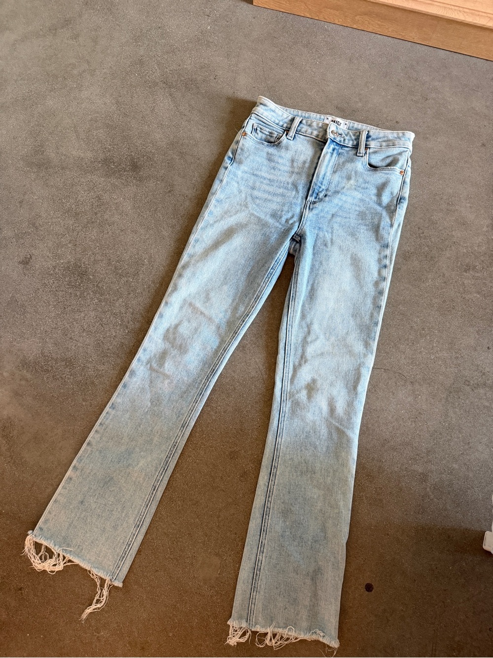 PAIGE Light Blue Flare Jeans with Raw Hem